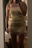 I bought this dress for our 20s-themed dance and it did not disappoint. The fabric isn't itchy at all like usual sequined dresses. It doesn't ride up and sparkles under any light. Order a dress size up if you want it to be a bit longer. - Paige G.