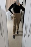 The material was of great quality. I love how this bodysuit is so versatile. I will be wearing it to work at least once a week as a teacher. It fits a little snug but that is the style of the shirt. - Adriana A.