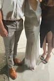 This dress was a backup dress on my wedding day! Glad I had one because it was perfect to get loose and have fun. Very lightweight but good material. Dress beads make it look pricey but do not shine too much! - Lupe C.