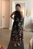 This dress is pretty but it runs SO LARGE. The photo is with me holding in the waist and I'm still swimming in it. Normally I am a size 4 or S but for this dress would go XS or smaller. Definitely size at least one size down. Otherwise, the fabric is good quality and heavy. The embroidery is pretty and the design is super cute. - Helena S.