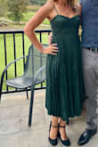 This dress was amazing. It fits perfectly, cut low enough but not too low for a standard strapless bra. Gorgeous color with the print and pleat. I received several compliments at the event! - Stephanie M.