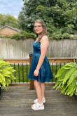 My daughter tried several homecoming dresses and found this one!  The teal blue is a stunning color.  As a parent, I appreciate the length of this dress. Fit is tts, adjustable straps were helpful.  Love the A-line fit AND this dress has pockets!!  A small wristlet fits into the side pocket.  Thank you Lulus!! - Traci S.