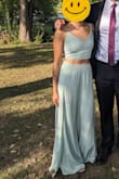 Got this last minute after procrastinating finding an outfit for an outdoor wedding. Fast shipping and got it in only a couple of days and it was perfect. The top fit perfectly and the bottoms were just a touch too big around the waist. The material isn't the best, pretty easy to snag and it wrinkled really easily but it looked great in pictures. One thing - it was a windy day and I had to be pretty careful about not letting the slits on the side open up too much... - Grace F.