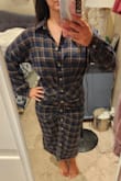 The dress fits perfectly in the hips and waist but is a little bit bigger on top, but not so much that I would want a different size. The material is soft and great quality. The button holes are very tight, which I was annoyed with at first, but then realized it's better that they're tight to avoid any slipping open. - Kristin M.