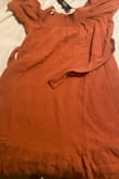 This dress looks like a washed-out red potato sack with a sash. Horrible cheap-looking dress, not at all like the fake picture of the cute dress on the website. I will likely never shop at Lulus again as a result of their fake pictures not matching what the clothing actually looks like. - Scarlett O.