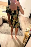 I ordered this dress for my sister's rehearsal dinner and I love it. It fits perfect and is really different in its pattern and shine. The sleeves look better on the shoulder in my opinion. Having them hang off gives me some 80s prom vibes. - Emily O.