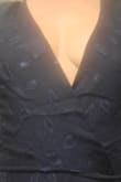 This is a stunning dress.  In the picture, it doesn't reveal how deep this is cut in the breast area. I'm a lady who likes to wear a bra and is very small-chested. It is true to size. - Velarie H.