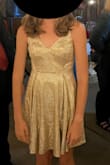 My 14-year-old daughter with an athletic build wore this to an event where she had to wear a gold dress. It was a nice color but heads up that the sparkles do come off, although it isn't too bad. - Andi S.