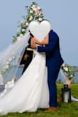 This dress was so perfect for my wedding. It was absolutely beautiful and really comfortable (I had purchased another outfit for the reception and didn't even end up changing!). I am short so I had it hemmed at the bottom, but other than that, it fits perfect!! Such an incredible price for the amazing dress! - Chelsea M.