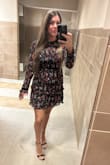 It doesn't stretch and was a little tight in the mid-section, but overall I loved the way it looked on me.. - Gabriela B.