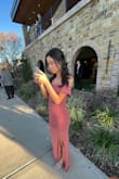 My daughter bought this for a wedding and the XS fit her like a glove: she's 5'3" and 100lbs. The fabric was very comfortable and didn't need ironing at all. The cut is fitting so walking upstairs was a bit challenging. - Sarah N.