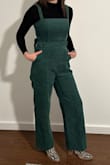 Love that this is cotton corduroy and not polyester or other synthetic material. I chose my size based on fit recommendations and reviews and found it fit true to size. Soft and the straps are adjustable. Cute with long sleeves and boots! - Robbie F.