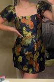 I love it! I bought it for a wedding in December and I'm so excited to wear it. The material is not stretchy (as advertised) so I went with a medium which I think was the best choice although it is a little loose in the waist. A small would've been too short when sitting though, so I think it works! - Allison L.
