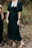 This dress was beautiful for family photos. It fit well, but it did come open in the chest area; a safety pin worked to keep it closed. The dress also arrived pretty wrinkled. I was nervous to iron it and don't own a steamer. A few days in the bathroom with shower steam worked; it loosened the wrinkles up. - Emily O.