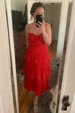 I'm obsessed with this dress - it looks so much more expensive on! I wore it to my sister's wedding and got compliments all night long. My bust put me between sizes but I went with a medium so that I could go bra-less. As other reviewers said, the bodice area does bulge out a little bit depending on posture but that didn't bother me. - Laura B.