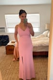 I LOVE this dress! The fabric plus the 2nd layer of lining add a little weight to it but it felt so high quality. I had it hemmed a bit plus a slit added to make it a little more fun. I didn't have to wear a bra with it and a Medium fit me perfectly! I always usually fall between a S and M. Had it been a looser style, I would've gotten a Small but for the fitted design, snug fabric, plus having a larger bust, a M was perfect. Highly recommend!! - Veronica D.