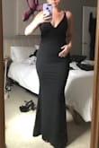 This dress, although hard to put on, fit my body well. As soon as I started to walk around though, it was uncomfortable to move around in as it is pretty tight through the hips. - Teresa L.