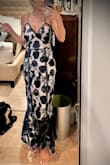 Really cute dress, just fit much larger than expected. I would size down. The lace is super pretty and continues to flare out at the bottom, which can be a little issue where there is no lining. - Rachel R.