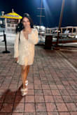 When I saw this dress I immediately fell in love with it. I bought the dress and the shoes like the model wore in the picture to go with it and I got compliments the entire night. It was simply beautiful. It wasn't tight and fit perfectly. It is very low cut so maybe use tape or something if you want. - China H.