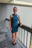 I received many compliments on this dress at a recent wedding. People loved the neckline and color.  It runs small, especially through the hips. I recommend sizing up. - Megan S.