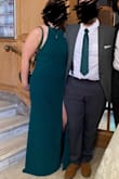 This dress is GORGEOUS! The color is a deep, rich, luxurious, beautiful, emerald green. It also stays in place better than expected! I used a little double-sided tape and we were good to go. I also didn't need any shapewear with this. I had multiple people say to me that I was best dressed in this. I would just make sure you give yourself time to get tailored if need be. I was about 5'10" with the shoes I was wearing and the dress just kissed the ground. Any shorter and it would be too long. But overall, Love! - Lindsey N.