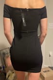 I was super excited to order this dress and thought it would be super cute, but it's just a little boring. It wasn't made for my flat-chested gals. It is sleek and a great neutral! It's definitely comfy too! - Camryn C.