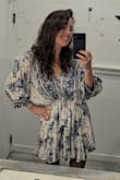 This pattern and material is so nice. I am obsessed with this dress!! It is definitely short for me- I am between 5'9/5'10, and I wore spandex shorts underneath that you couldn't see but made me more comfortable. There's a lot of fabric and you tie the waist so you could easily size up or down depending on how flowy/material you prefer. I like a lot, but I could have easily sized up to XL and tied it to have probably a similar look. - Margaret C.