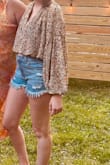 I recently wore the Season of Blooms Cream Multi Floral Print Balloon Sleeve Top to a groovy-themed birthday party, and it was an absolute hit! The top's retro-inspired floral print perfectly suited the theme of the event, making me feel like I had stepped right out of the '70s. - Faith B.