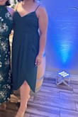 This dress was very flattering. It is an A-line fit that sits at the waist and falls nicely over the mid-section. I wore it to a wedding and got many compliments. - Mara R.