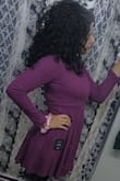 This dress is comfortable, good quality, and a beautiful plum jam color. I prefer my dresses and tops to be loose, so my next purchase will be in a medium, however, this fits exactly as it should. It hugs my body well which is nice, but you can see my bra cup line. As a preference, I will wear something under it to prevent that. The flair on the dress is complimentary to my body shape and I love how it flairs more when I dance around. The colour is slightly off when compared to the picture and I believe that has to do with the bad lighting in my house. The mauve shows in the natural light, but I prefer the purple tone. - Shazia