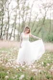 I was lucky enough to wear this dress twice! I had to get some alterations, mostly on the bottom because it was so long, but kept the train super long which was beautiful!
Highly recommend this dress! It looked beautiful on the beach in Mexico! - Amy R.