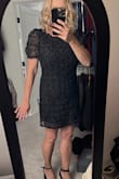 This is a very cute dress, BUT it is not fitted around the waist as shown on the model. It hangs straight on the sides, not giving much shape.  Also, I figured because she is taller it would be longer on me since I'm only 5'3" but it is very short. I can not order a smaller size.  Overall, a pretty dress, just beware of the length. - Cindy D.