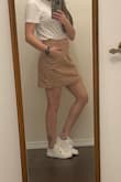 This skirt is so cute! It's a very thick material so too warm for warmer weather. I have been wearing it with black tights now that the weather has cooled off. When I sit in this skirt it's a littttle on the short side but it's fine. The best feature though is the pockets! They fit my phone comfortably. Better pockets than most of my pants! - Brianna S.