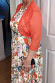 Nice colors to match a teal/coral/grey wedding color scheme. Nice flowy material, with sewn-in lining. Sturdy and well-made construction of the dress. I topped it with a matching bolero. - June A.