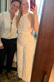 I got compliments on this jumpsuit allllll night long at our rehearsal dinner. It fits like a glove. I wore 2 in booties and it was the perfect length. The zipper got a bit stuck on the lace overlay and the waist seam, but I was able to wiggle out of it. - Jenny K.