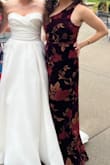 The dress is so much prettier in person. The pictures don't show that the front has a slit from the two sides draping together. I got so many compliments! I would order a smaller size next time though. - Betsy J.