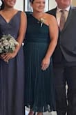 I bought this dress to wear to my sister's wedding. The zipper was a little glitchy but nothing a little WD40 couldn't fix. I had entered a bunch of information to determine what size to get. Overall, the dress fit great and was comfortable the entire evening. - Amanda Z.