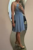 I'm usually a size S but I decided to listen to the reviews and size down to an XS. I'm glad I did because it's a perfect fit. The straps are adjustable too so it helps. It's also very flattering and the material is of nice quality. It probably just needs a quick steam to get any wrinkles out. - Natalie H.