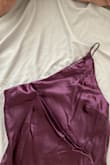 This dress was so disappointing and the product I received was defective. First, the strap is just an elastic band with no adjustments. It can fit weirdly on top and there's nothing you can do to fix it. Second, the dress I received had extra fabric on both sides. At first, I thought it was just tight but no matter how much I smoothed it out, the the extra material was still there. And the inner lining fit perfectly with no clumping. Very upset because I was going to wear this for my first wedding anniversary. Save your money and get something else. - Amreen S.
