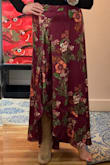 I got this skirt in size medium in both plum and green. The fabric wasn't flimsy but I would have preferred more weight.
Even with high boots, it was too long and unforgiving of my tummy. Shapewear would have helped, but the length was a deal breaker - I don't have 6-inch heels and didn't want the skirt to drag on the ground. - Helen B.