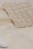 A perfect detail to keep your things close to you and don't ruin the outfit. The only thing is that it doesn't have any textile bag inside, so I decided to buy a small white bag that fits inside, so I don't lose anything that I put in the bag. - Sherly S.