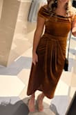 I wore this dress to a fall wedding and it was perfect. I got lots of compliments on the color and style. I had seen other reviews mention the dress falling down, but I did not have that issue. The slit did not bother me, but it does come up pretty high when you are sitting. Otherwise, I danced the night away! - Hali P.
