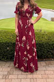 Dress is true to size. Being a wrap dress, I was able to adjust how tight/loose I wanted it and the length was perfect with heels on. Worth the buy!! - Brenna B.