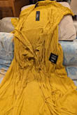 The material is pathetic. It's totally crushed and this picture and information are misleading. In reality, this is like a maternity wrap-up gown with loads of wrinkles. This is so much worse than local department stores. - Parul D.