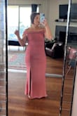 I bought this to wear as a bridesmaid dress at my cousin's wedding. I wanted something that I wouldn't normally wear. This was perfect. I felt so elegant in it. The ruching helped conceal the belly area (I also wore Spanx) where I'm most uncomfortable and it accentuated my booty. I did have to get it hemmed quite a bit but the seamstress I went to did great work. I originally ordered a small and exchanged it for a medium because it was too tight. The only issue I had was that I couldn't really raise up my arms all night because of the off-the-shoulder design but still not a deal breaker. - Audrey O.