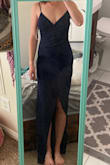 The material is a little stretchy which was good. The area where it connects on the hip for the slit made a little bit of a weird shape and sat a little funny. I felt the bust part was a little loose as well as the straps since they weren't adjustable. I ended up ordering and wearing a size XS which was more snug and comfortable for me. I was constantly pulling up the bust part to make sure my boobies weren't coming out though, despite using a safety pin to help close the neckline a little bit. Overall really pretty dress, just minor tweaks depending on body shape and size it seems. - Roxy M.