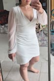Love the dress. It makes my body look better than I thought. 
I'm short and the dress fabric doesn't overpower me. With my cowboy boots or heels it's going to look fire. It's a bit low-cut for me. So I bought a bandeau to go underneath it. - Kristine S.