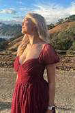 My daughter wore this dress to a family wedding and she looked stunning! The busy area was a little loose but she normally has trouble with that in most dresses no matter what brand. It still worked and wasn't uncomfortable. She loved this dress and felt confident in it! The material was heavy but not uncomfortable! Very well-made dress. - Lindsay M.