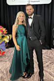 I wore this dress to an event and got tons of compliments. I typically wear a small, but had to exchange for a medium in this particular dress. The waist is VERY small. Dress is a darker hue of green than what's pictured on the site, but still very pretty. - Melanie W.