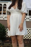 It fit perfectly and was exactly what I needed. Very flattering as well. The only negative is I did have to safety pin the sleeves to my bra so they wouldn't slide down but other than that it was great. Not too short either! - Charlotte B.